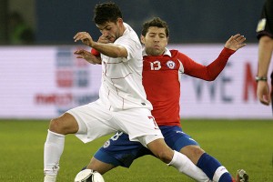 Chile's Rojas challenges Serbia's Dordevic during their friendly soccer match in St. Gallen