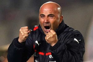 Chile's head coach Jorge Sampaoli celebrates a goal by his team during a 2014 World Cup qualifying soccer match against Bolivia in Santiago